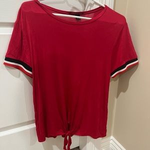 Simple red top with a knot design at the bottom